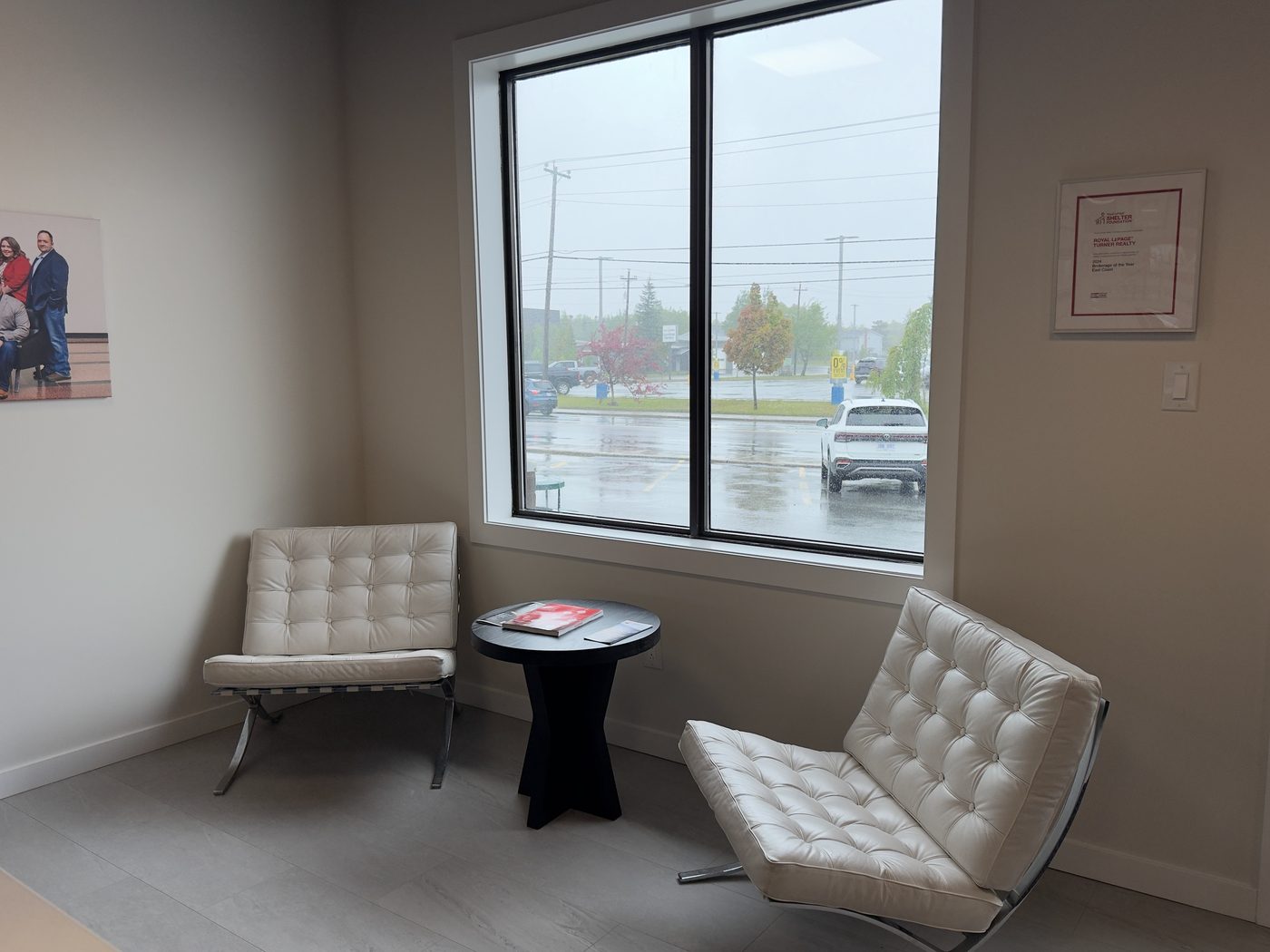 Client lounge with seating by the windows at the 204 Airport Boulevard office, Gander